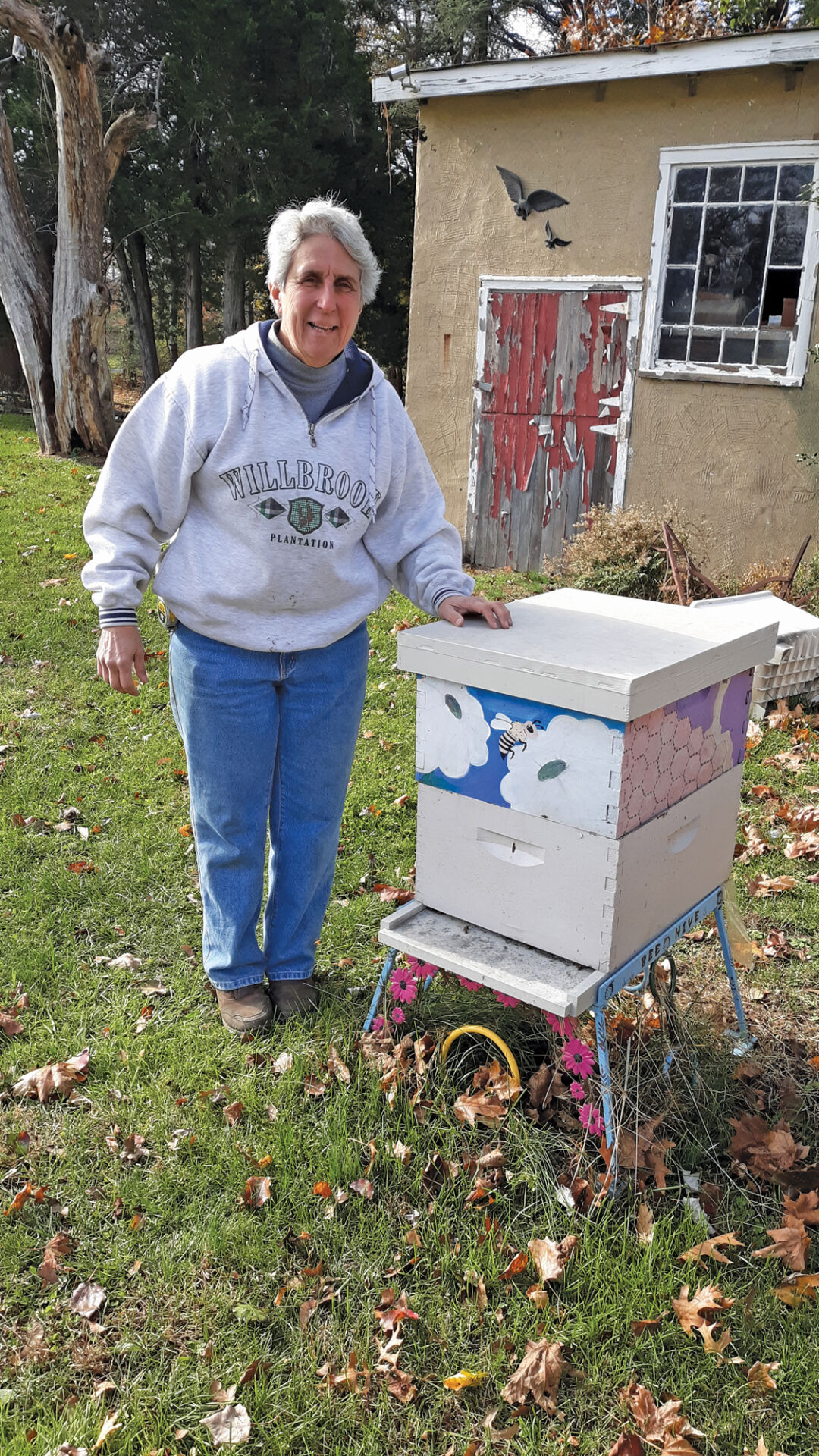 Sally with hive on her farm.jpg
